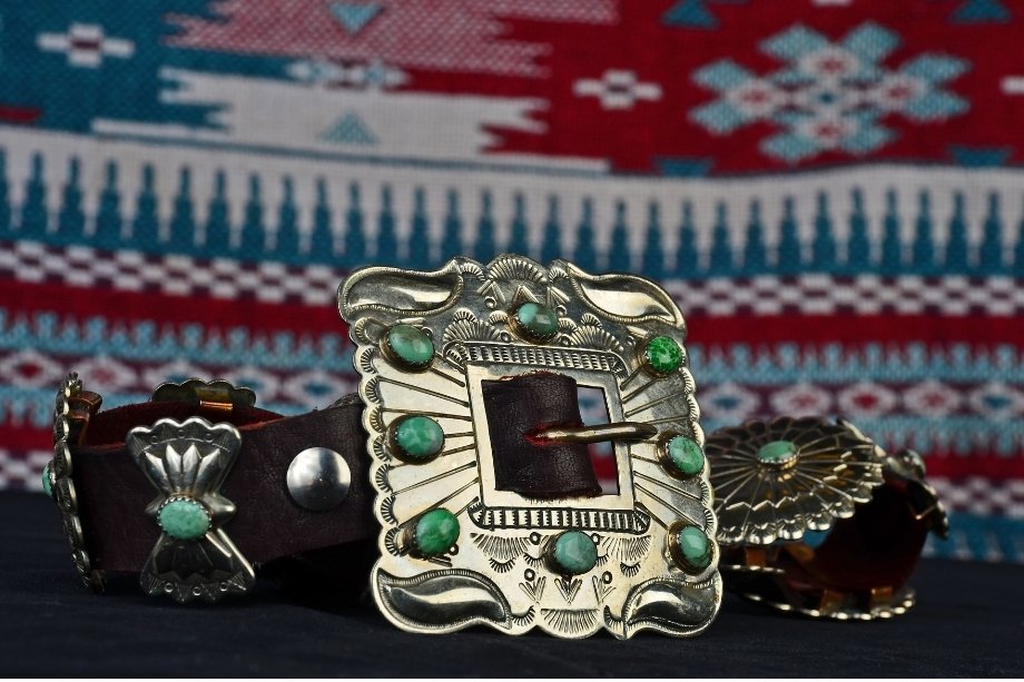 A premium leather Native American concho belt highlighted by deep blue turquoise settings.